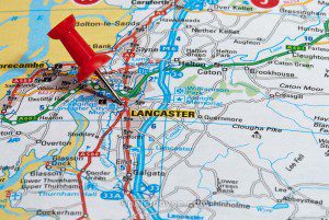 red map pin in road map pointing to city of Lancaster
